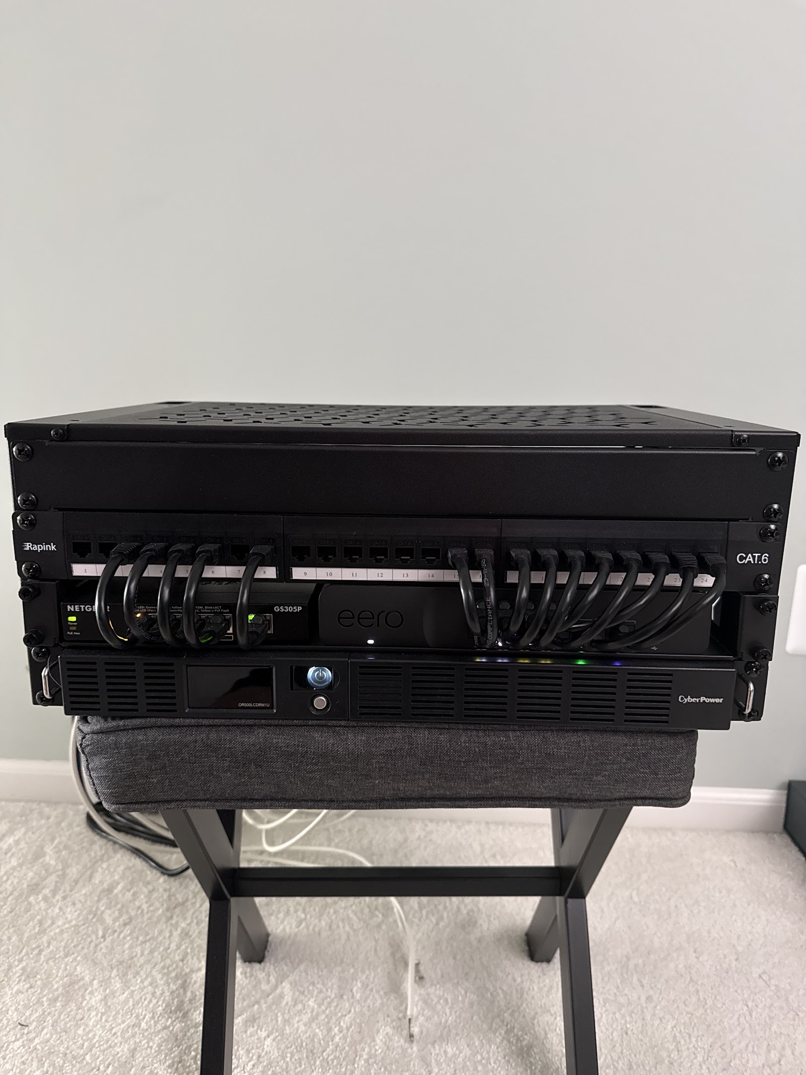 Organized structured cabling network rack with labeled patch panels installed for a Metro Detroit property