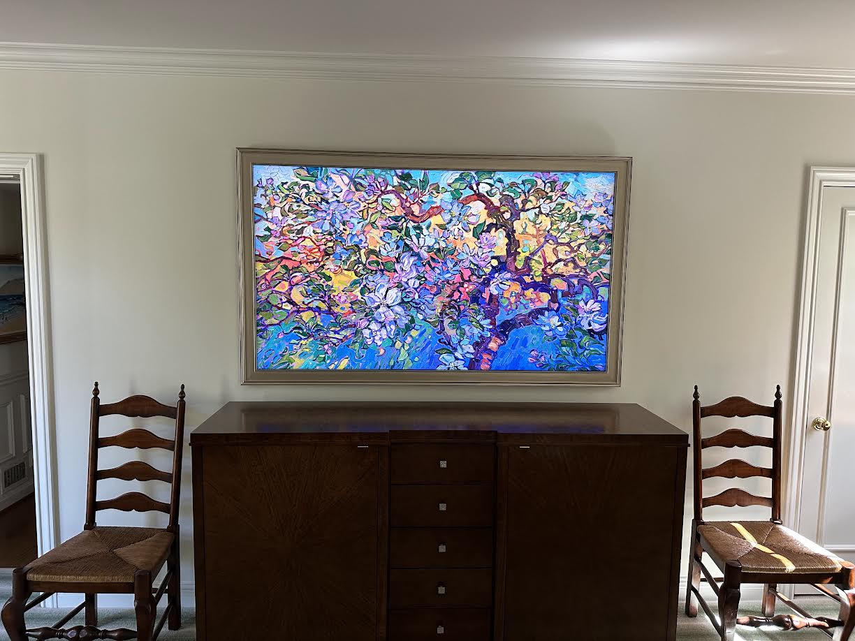 Professional TV mounting installation with a hidden art-frame display in a Metro Detroit area home