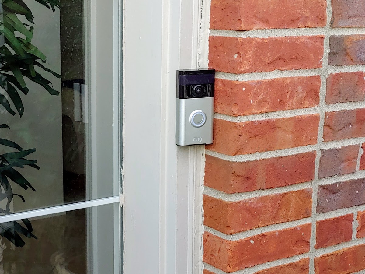 Video doorbell access control system installed beside an entry door